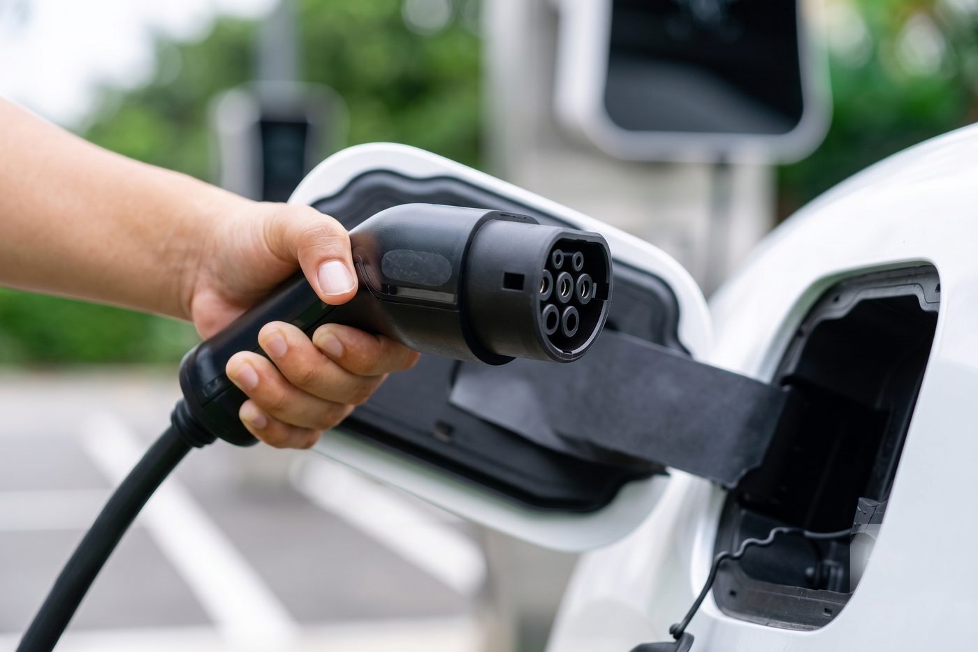 Type 2 connector being plugged into a commercial electric vehicle at a charging point